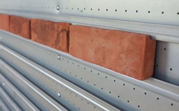 Brick slips - bricks are clipped or slid into place before finishing with pointing mortar - from Forterra Building Products